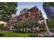 Exterior of a modern condo with manicured lawn and a sculpture at 435 S Tryon St, Charlotte, NC 28202