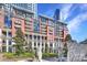 Beautiful condo building featuring multiple balconies and detailed statues in a landscaped outdoor setting at 435 S Tryon St, Charlotte, NC 28202