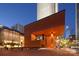 A view of a modern building with unique architecture and artistic landscaping at 435 S Tryon St, Charlotte, NC 28202