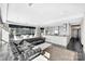 Bright living room with modern decor, city views, and seamless transition to the kitchen at 435 S Tryon St, Charlotte, NC 28202