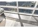 Bright living area features beautiful hardwood floors and a large window with city views at 435 S Tryon St, Charlotte, NC 28202