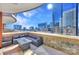 Comfortable outdoor lounge with skyline view and a stone-walled patio with a built-in fire pit at 435 S Tryon St, Charlotte, NC 28202
