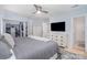 Spacious bedroom featuring a large closet, modern dresser, and comfortable king bed at 4725 Rounding Run Rd, Charlotte, NC 28277