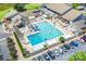 Aerial shot of a community pool with lounge chairs, tables and an outdoor social gathering area at 4725 Rounding Run Rd, Charlotte, NC 28277