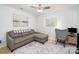 Well-lit office space with a comfortable sofa and desk perfect for work or relaxation at 4725 Rounding Run Rd, Charlotte, NC 28277