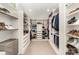Custom walk-in closet featuring built-in shelving and ample storage for clothes and shoes at 4725 Rounding Run Rd, Charlotte, NC 28277