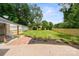 Expansive backyard with lush green lawn, mature trees, and a newly installed wooden fence for privacy at 5817 Red Carriage Ln, Charlotte, NC 28212