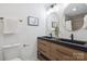 Modern bathroom with double sinks, stylish mirrors, and sleek fixtures, providing a spa-like experience at 5817 Red Carriage Ln, Charlotte, NC 28212