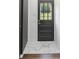 Welcoming entryway featuring a dark wooden door with glass and a striking marble tile floor at 5817 Red Carriage Ln, Charlotte, NC 28212