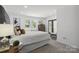 Bright main bedroom with neutral tones, carpeted floors, and views to the backyard at 5817 Red Carriage Ln, Charlotte, NC 28212
