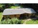 Aerial view of a home featuring a cozy screened-in porch, swimming pool, and lush yard at 5832 Thompson Rd, Charlotte, NC 28216