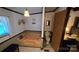 Bathroom featuring a soaking tub, toilet, and window, with a glimpse into an adjacent bedroom at 5832 Thompson Rd, Charlotte, NC 28216