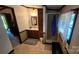 The bathroom features a shower stall, vanity with sink, mirror, and window for natural light at 5832 Thompson Rd, Charlotte, NC 28216