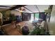 Inviting living room featuring a stone fireplace, hardwood floors, and comfortable seating arrangement at 5832 Thompson Rd, Charlotte, NC 28216