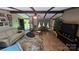 Open concept living space with lots of light, and beautiful flooring at 5832 Thompson Rd, Charlotte, NC 28216