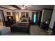 The bedroom features cozy carpet floors and is complete with a ceiling fan and a convenient closet at 5832 Thompson Rd, Charlotte, NC 28216