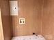 Bathroom with wood paneling and tile floor at 613 Catawba St, Chester, SC 29706