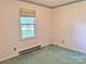 Bedroom with carpet, window with blinds and floral wallpaper border at 613 Catawba St, Chester, SC 29706