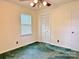 Bedroom featuring a ceiling fan, a window with blinds, and a spacious closet at 613 Catawba St, Chester, SC 29706