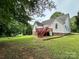 Backyard featuring a deck, lush grass and surrounding trees at 613 Stacy Ridge Rd, Gastonia, NC 28052