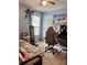 Cozy bedroom featuring carpet flooring, a workstation, and natural light from the window at 613 Stacy Ridge Rd, Gastonia, NC 28052