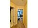 Hallway leading to a bedroom featuring a desk and to a bathroom with tile flooring at 613 Stacy Ridge Rd, Gastonia, NC 28052