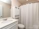 Cozy bathroom featuring white vanity and shower with white curtain at 739 Elders Story Rd, Fort Mill, SC 29708