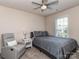 Comfortable bedroom with a bed, side table, and cozy chair at 739 Elders Story Rd, Fort Mill, SC 29708
