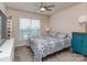 Comfortable bedroom featuring ceiling fan, window, and stylish patterned bedding at 739 Elders Story Rd, Fort Mill, SC 29708