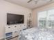 Bedroom with TV, white organizers, neutral walls, and a ceiling fan at 739 Elders Story Rd, Fort Mill, SC 29708