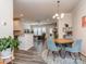 Inviting dining area with modern furniture and a view of the living room and kitchen at 739 Elders Story Rd, Fort Mill, SC 29708