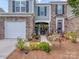 Beautiful exterior with brick and siding, lush landscaping, and a welcoming front entrance at 739 Elders Story Rd, Fort Mill, SC 29708