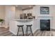 Open-concept kitchen with bar seating, stainless appliances, and modern finishes at 739 Elders Story Rd, Fort Mill, SC 29708