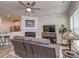 Living room featuring a fireplace, television, and a view of the kitchen at 739 Elders Story Rd, Fort Mill, SC 29708