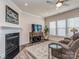 Cozy living room featuring a fireplace, television, and neutral decor at 739 Elders Story Rd, Fort Mill, SC 29708