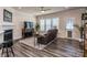 Cozy living room featuring a fireplace, ceiling fan and lots of natural light at 739 Elders Story Rd, Fort Mill, SC 29708
