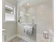 Modern bathroom with a glass shower and elegant tile work at 7732 Waverly Walk Ave, Charlotte, NC 28277