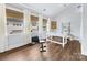 Brightly lit bedroom that has an exercise area and a desk at 7732 Waverly Walk Ave, Charlotte, NC 28277