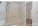 Bathroom with a combined shower and tub featuring a neutral color scheme at 9701 Kent Village Dr, Charlotte, NC 28269