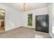 Spacious carpeted bedroom with natural light and a large safe at 9701 Kent Village Dr, Charlotte, NC 28269
