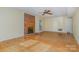 Spacious living room with hardwood floors, brick fireplace, and natural light at 9701 Kent Village Dr, Charlotte, NC 28269