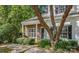 Charming home with brick facade, inviting entrance, and lush landscaping provides pleasant curb appeal at 10105 Reindeer Way Ln, Charlotte, NC 28216