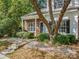 Traditional exterior with brick accents, mature trees, and a stone pathway at 10105 Reindeer Way Ln, Charlotte, NC 28216