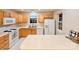 Well-lit kitchen with white appliances, a window over the sink, and plenty of counter space at 10105 Reindeer Way Ln, Charlotte, NC 28216