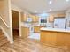 Bright kitchen boasts ample counter space, wooden cabinetry, modern appliances, and a breakfast bar at 10105 Reindeer Way Ln, Charlotte, NC 28216