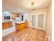 Spacious kitchen with modern light fixture, stainless steel appliances, and french doors to the backyard at 10105 Reindeer Way Ln, Charlotte, NC 28216
