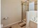 Bathroom featuring a tiled shower with glass door, soaking tub and neutral color palette at 1012 Leland Dr, Wesley Chapel, NC 28104