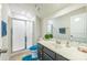 Bathroom featuring a walk in shower and a dark vanity with a light countertop and double sinks at 1012 Leland Dr, Wesley Chapel, NC 28104