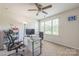 Home office features a ceiling fan, desk, printer, comfortable office chairs, and a window view at 1012 Leland Dr, Wesley Chapel, NC 28104