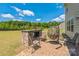 Outdoor patio features a stone cooking area with counter space and comfortable seating at 1012 Leland Dr, Wesley Chapel, NC 28104